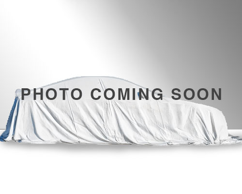 Vehicle with white sheet covering it, text reads coming soon